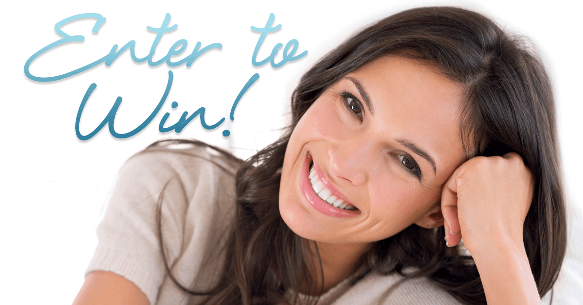 Enter to win: Young, attractive woman smiling and resting her head on hand