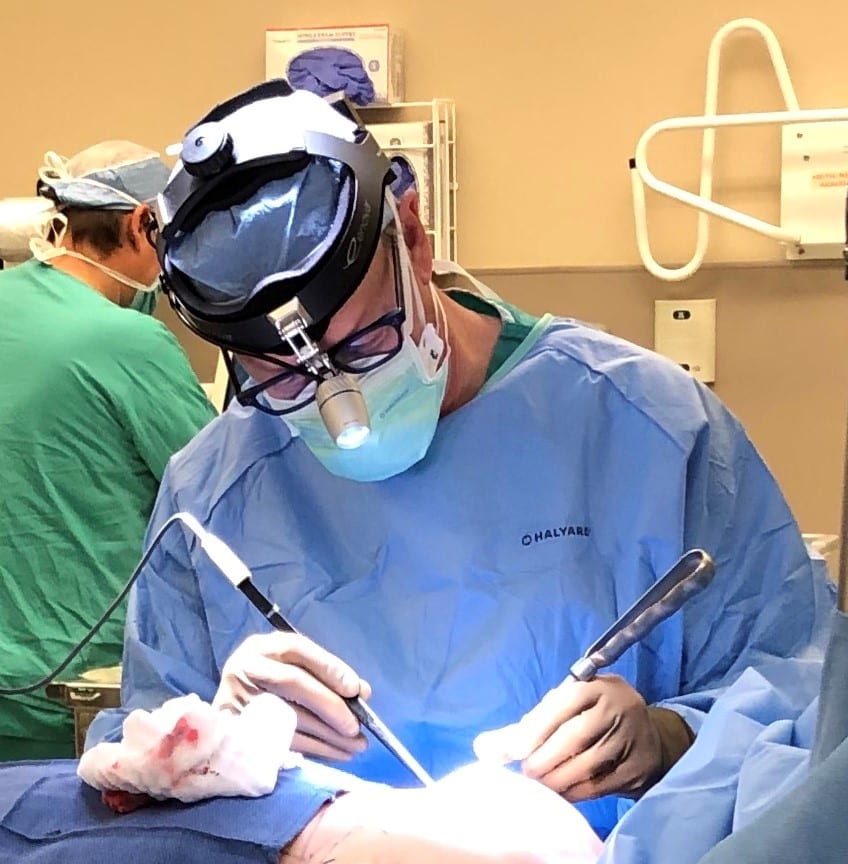 Dr. Colville operating on breast augmentation patient.